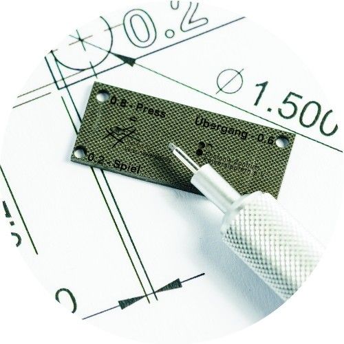 A composite plate on top of a technical drawing